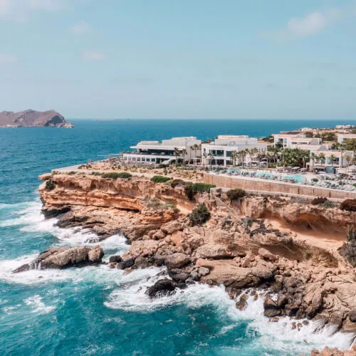 7Pines Resort Ibiza with Es Vedrà in the background and stunning coastal views.