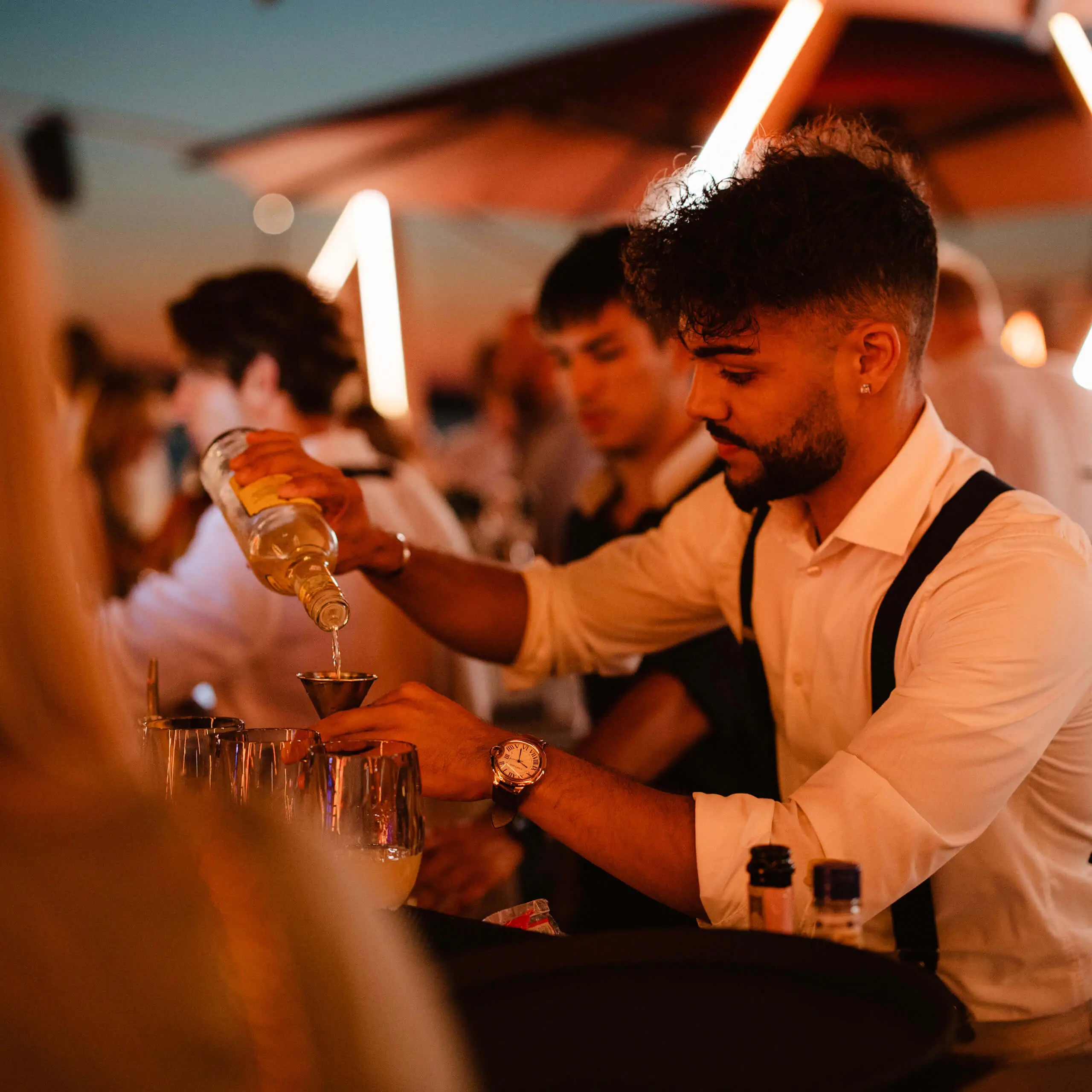Bartender preparing a cocktail at Cone Club at 7Pines Hotels & Resorts in Sant Josep de sa Talaia.