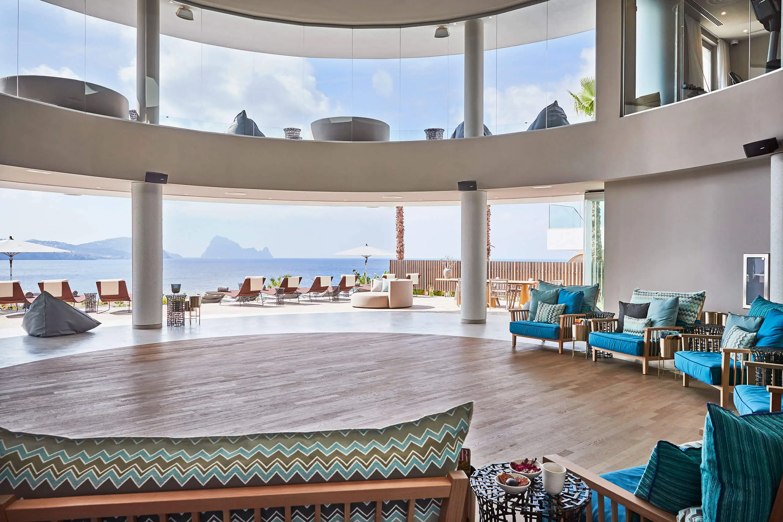 A serene lounge at 7Pines Hotels, blending tranquility and stunning sea views.