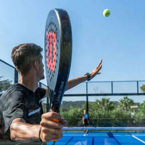 Man playing paddle tennis at 7Pines Hotels & Resorts, enhancing fitness in Sant Josep.