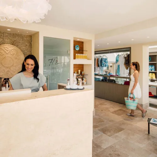 Women at Pure Seven Spa, featuring a welcoming receptionist and a relaxing interior.