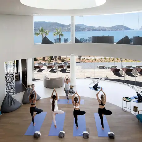 Yoga session at 7Pines with serene views, promoting wellness and balance for body and mind.